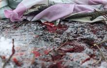 Наслідки атаки росіян по Харкову, кров на землі